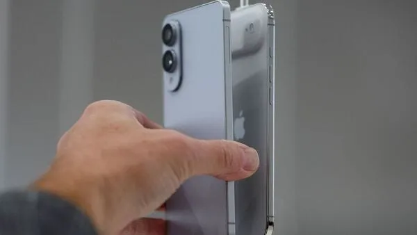 Woman looking at data on multiple screens in a modern office (AI Generated)